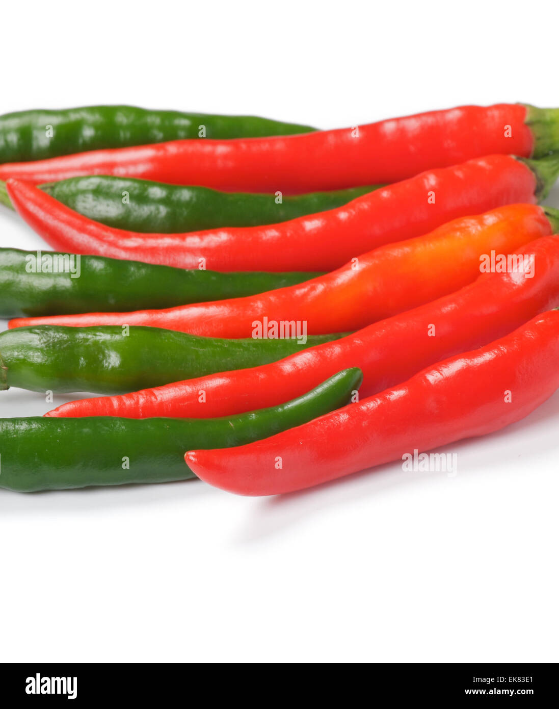 Arrangement of green and red chili peppers Stock Photo - Alamy