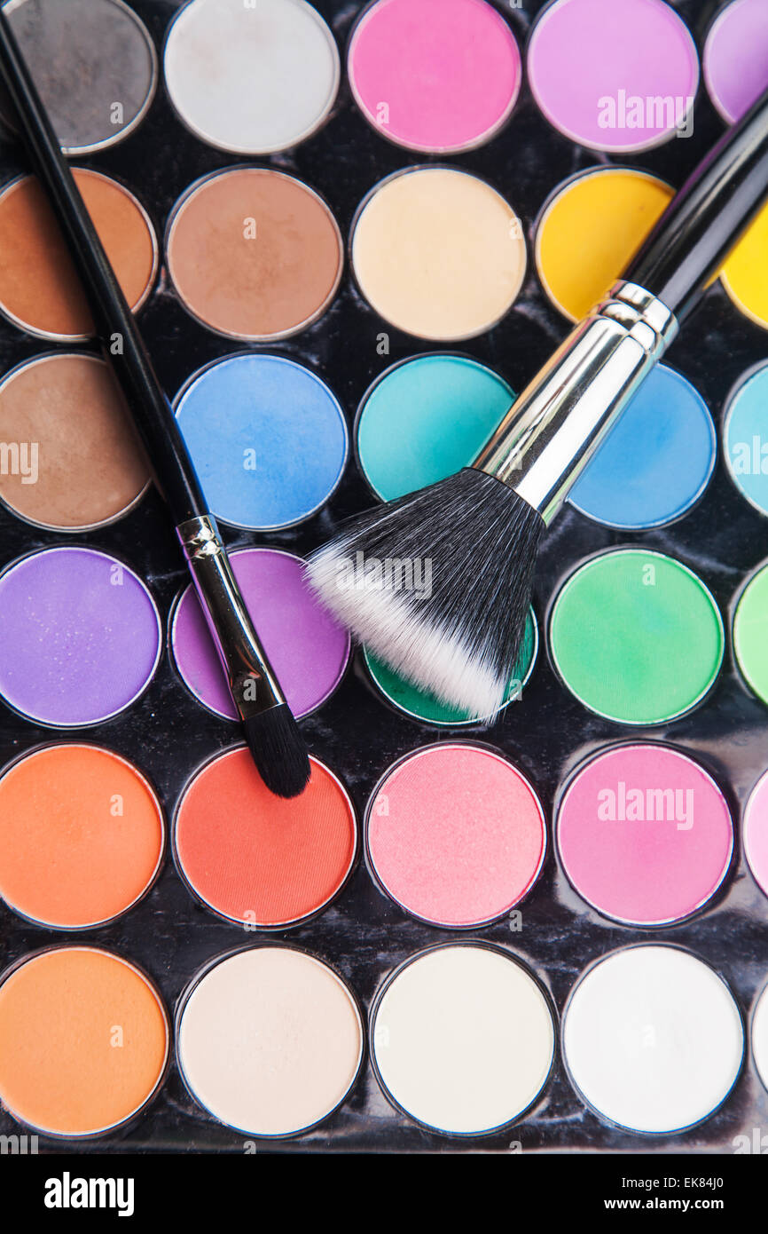 Makeup Brush Covered With Bright Holi Dry Powder Paint Stock Photo
