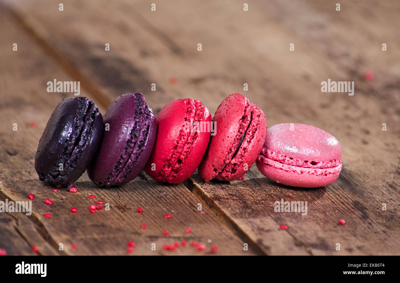 Macaroons on a wooden rustic table Stock Photo - Alamy