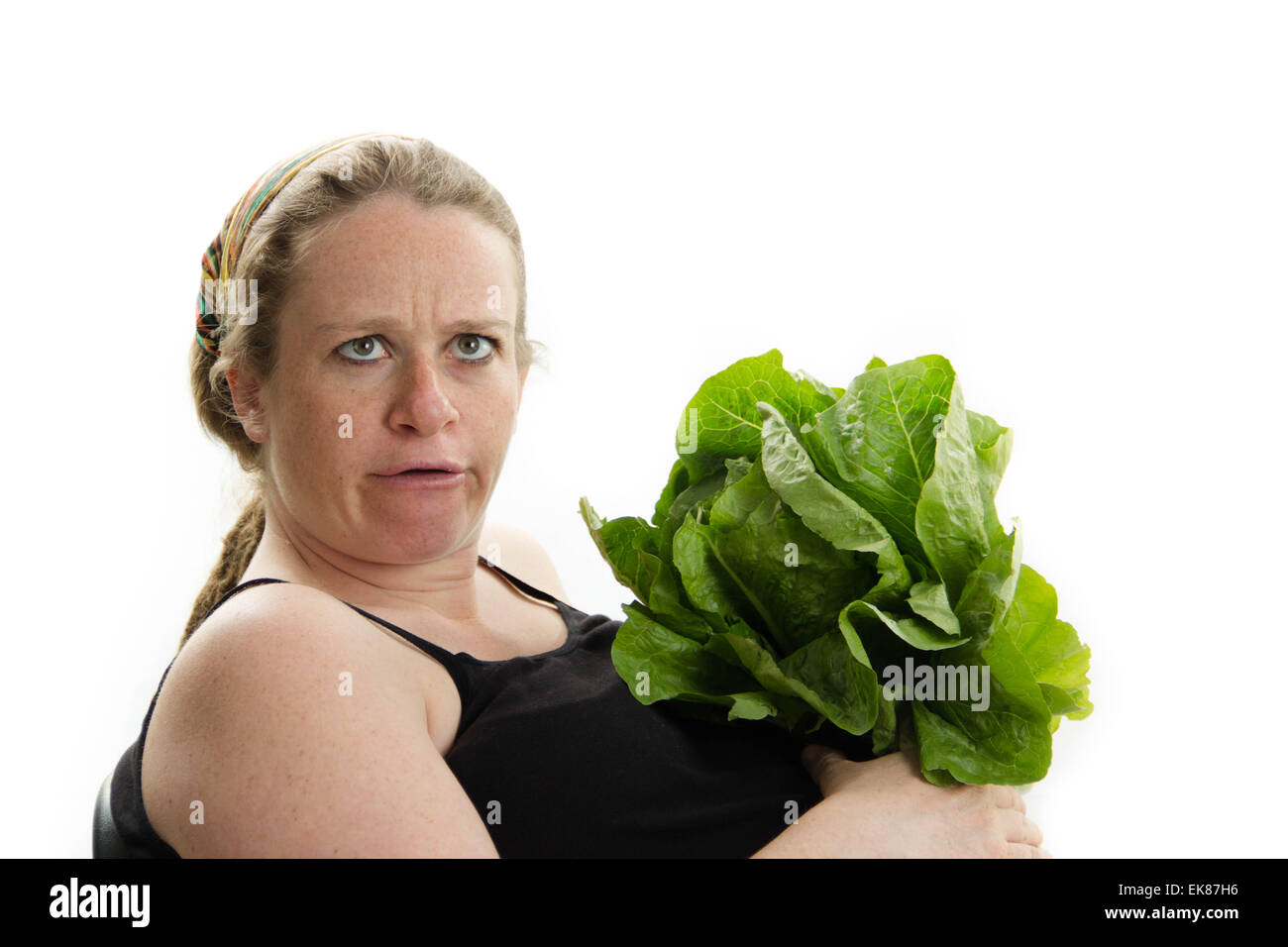 big pregnant woman silly face vegetables Stock Photo