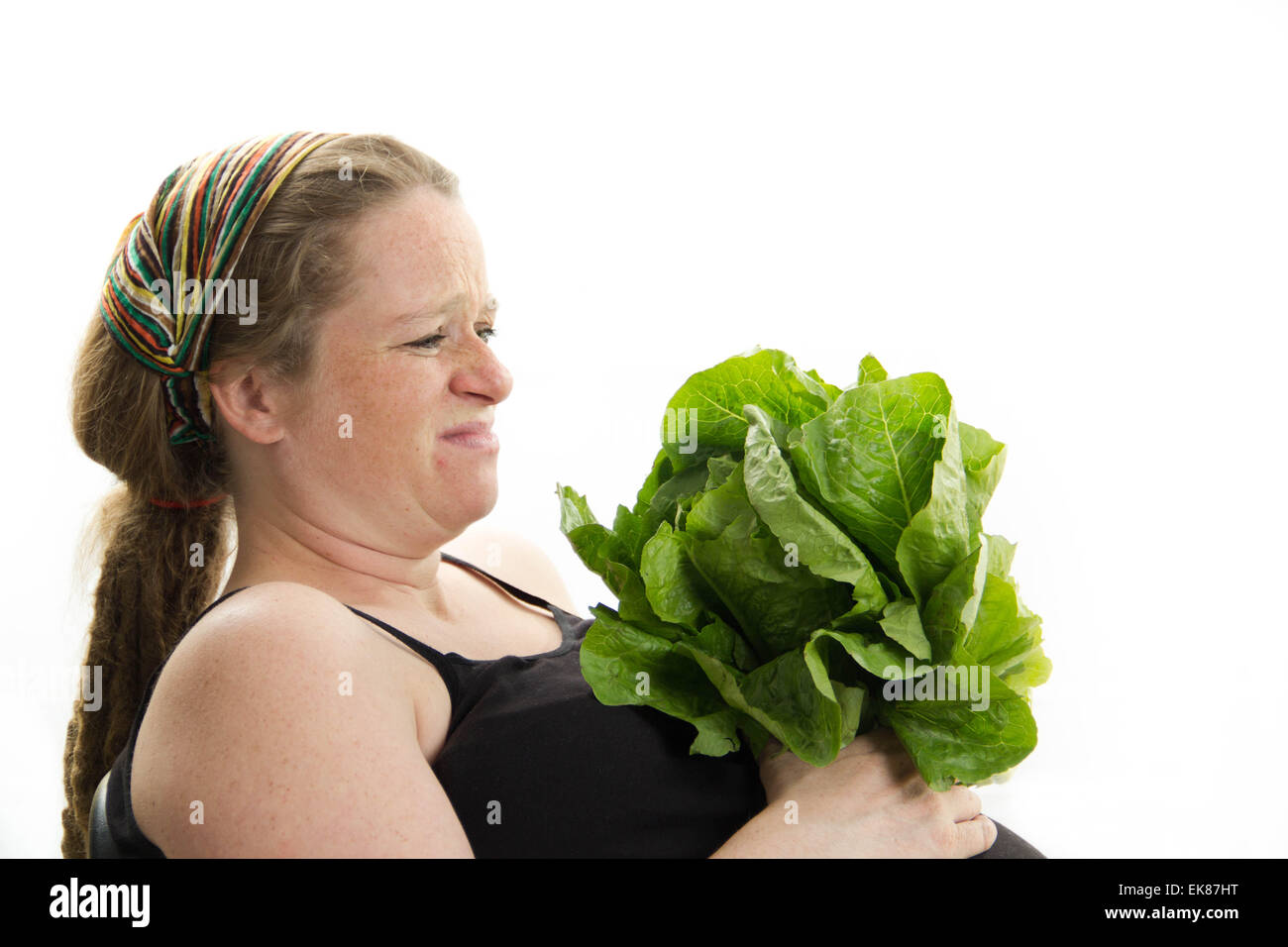pregnant woman holding belly and lettuce isolated on white background Stock Photo Alamy