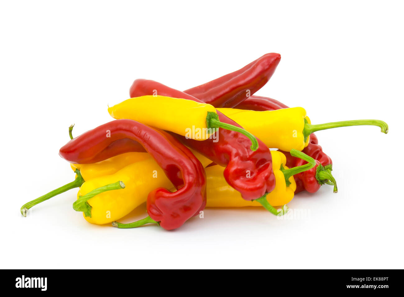 red and yellow peppers on white background Stock Photo - Alamy