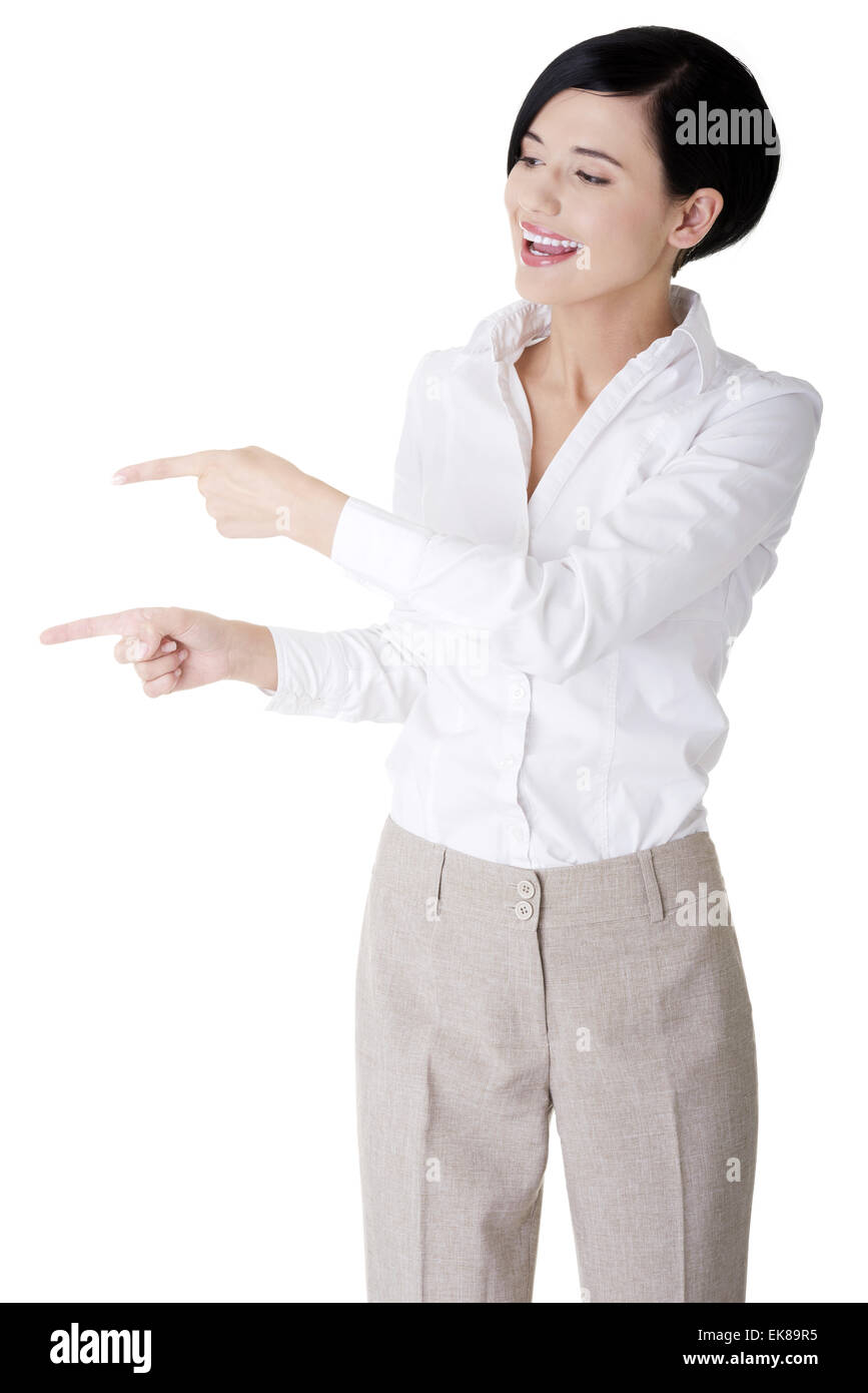 Beautiful business woman showing copy space Stock Photo - Alamy