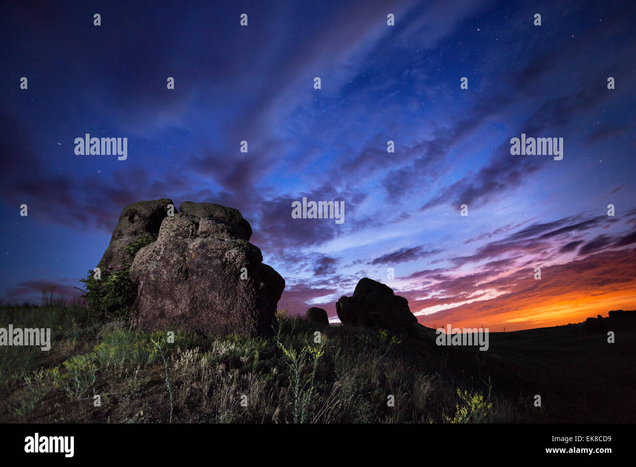 Beautiful summer night sky with stars and clouds. Rocks, plants and trail. Ukraine Stock Photo