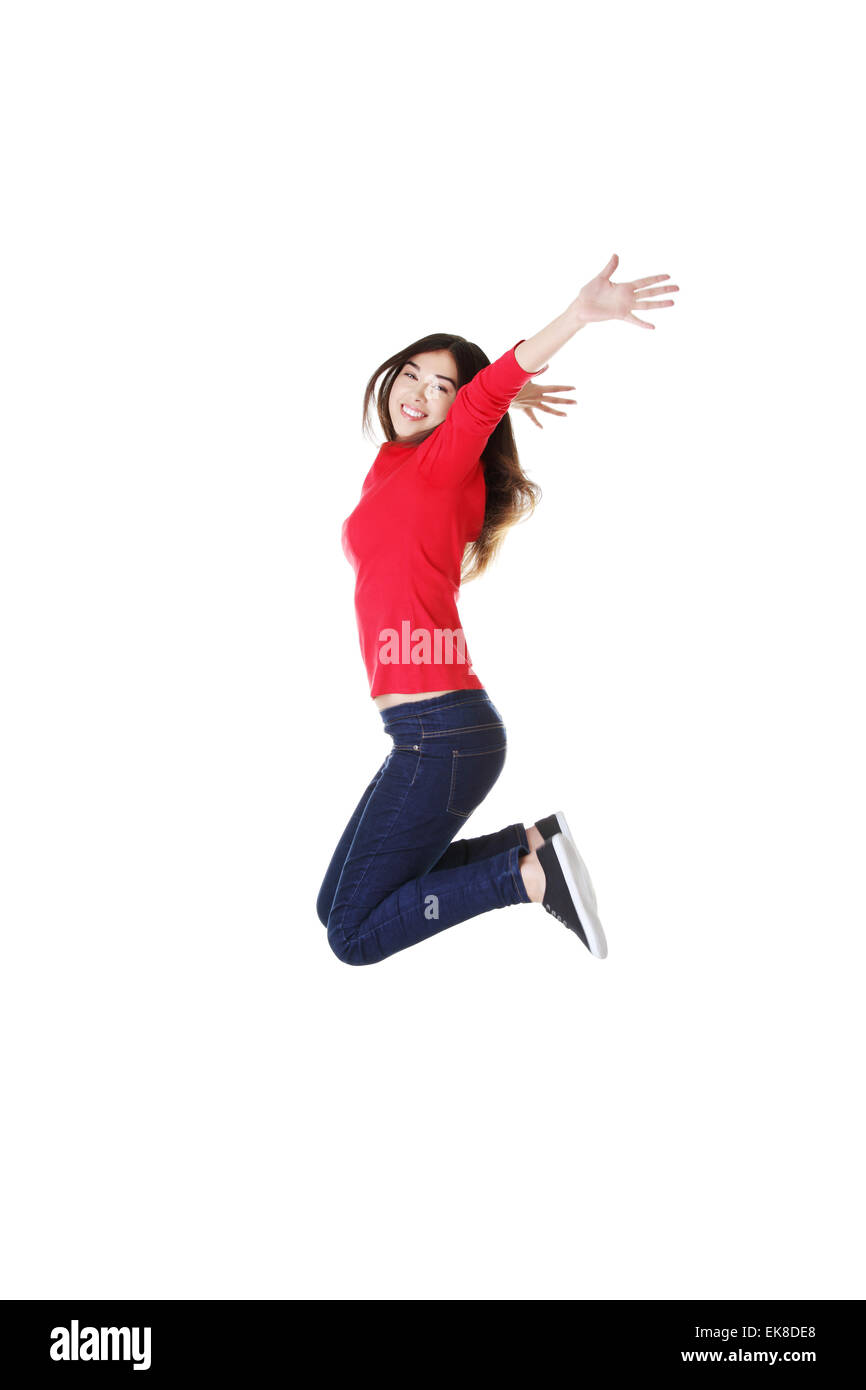 Happy caucasian woman jumping in the air Stock Photo
