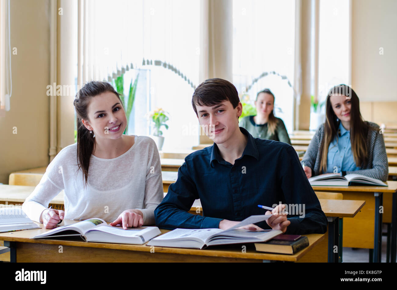 Two students at work with books Stock Photo Alamy