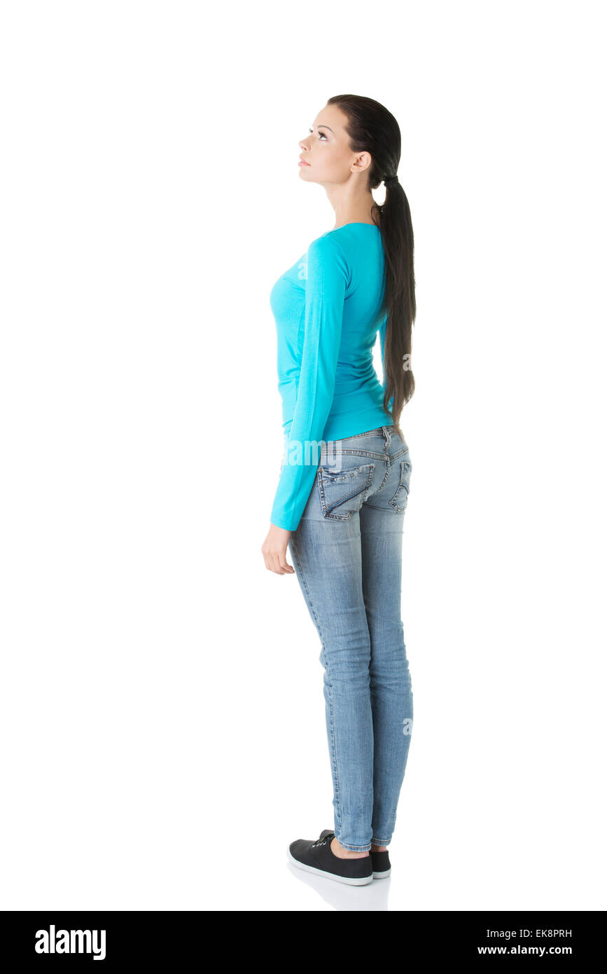 Young casual woman from behind looking up Stock Photo - Alamy