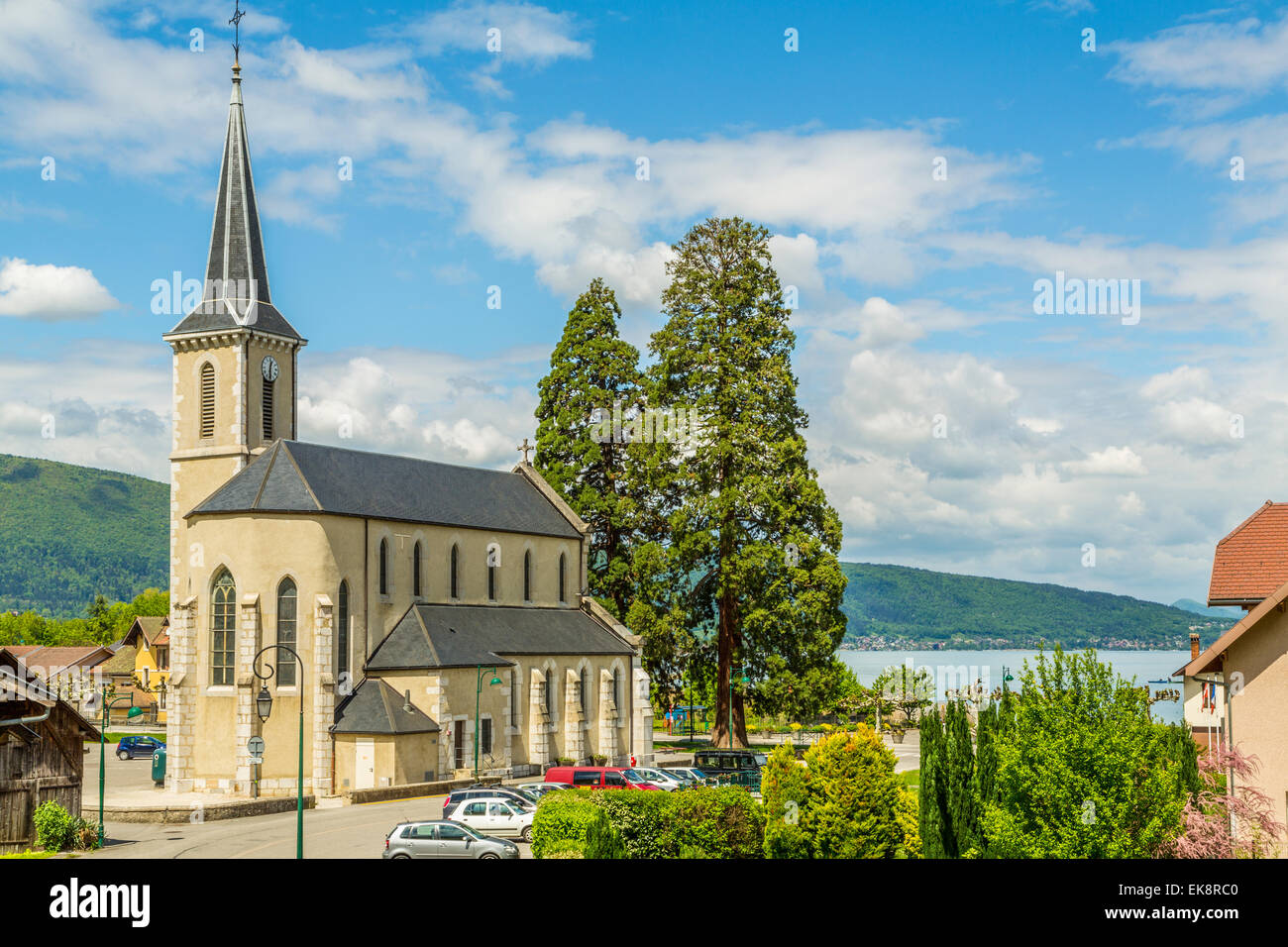 A portrait view of  Duingt Village Church on Lake Annecy  from the old Railway Tunnel road ,France Stock Photo