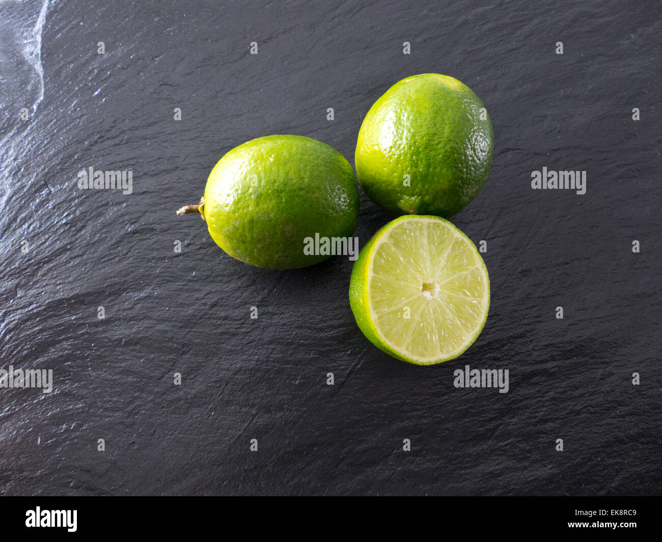 Limes on a slate Stock Photo