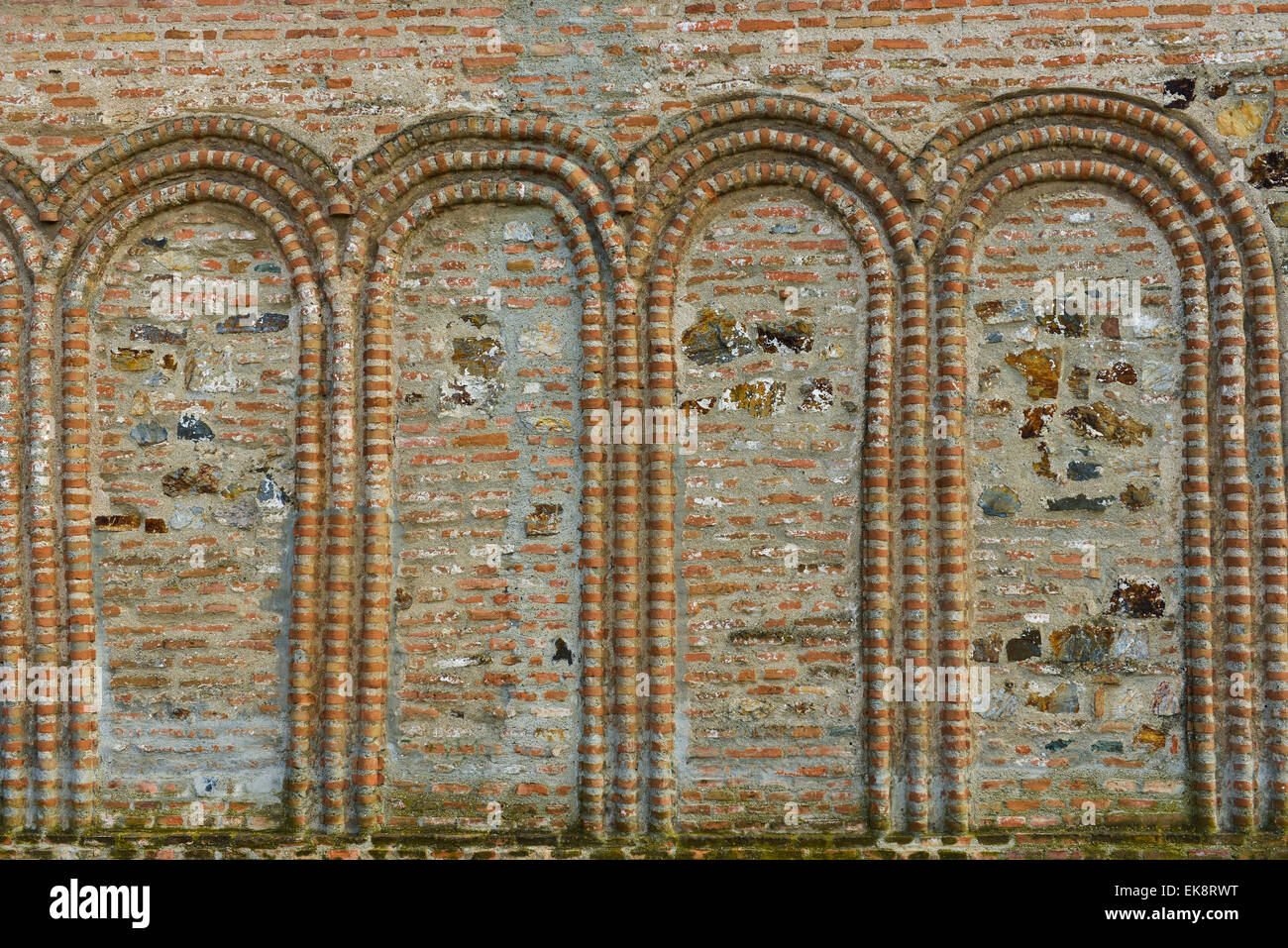 Stone arches on a ancient wall Stock Photo