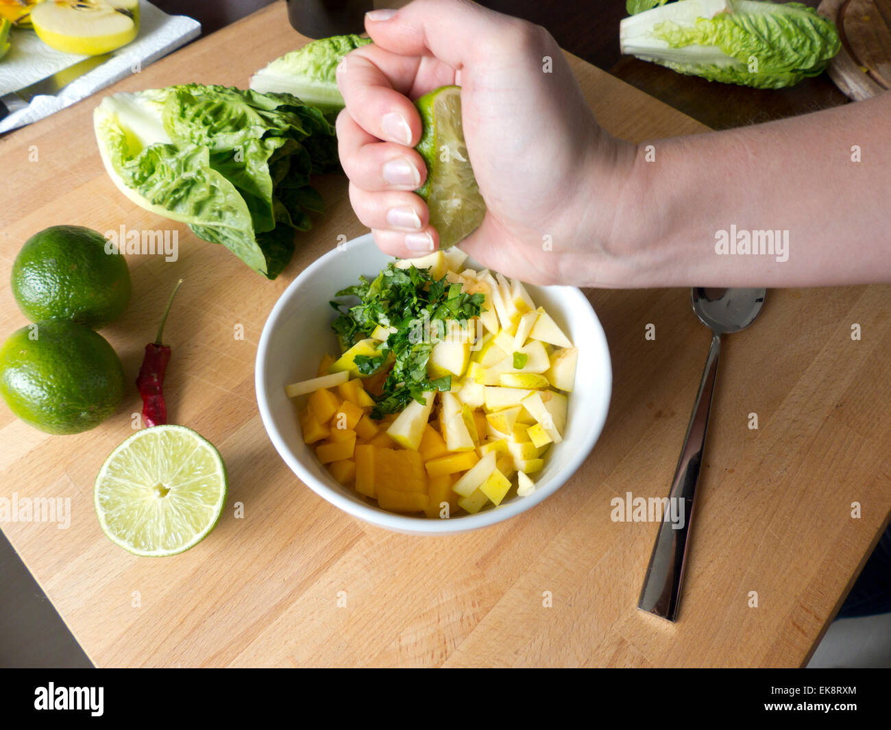 Lime is pressed for Romaine lettuce Stock Photo - Alamy