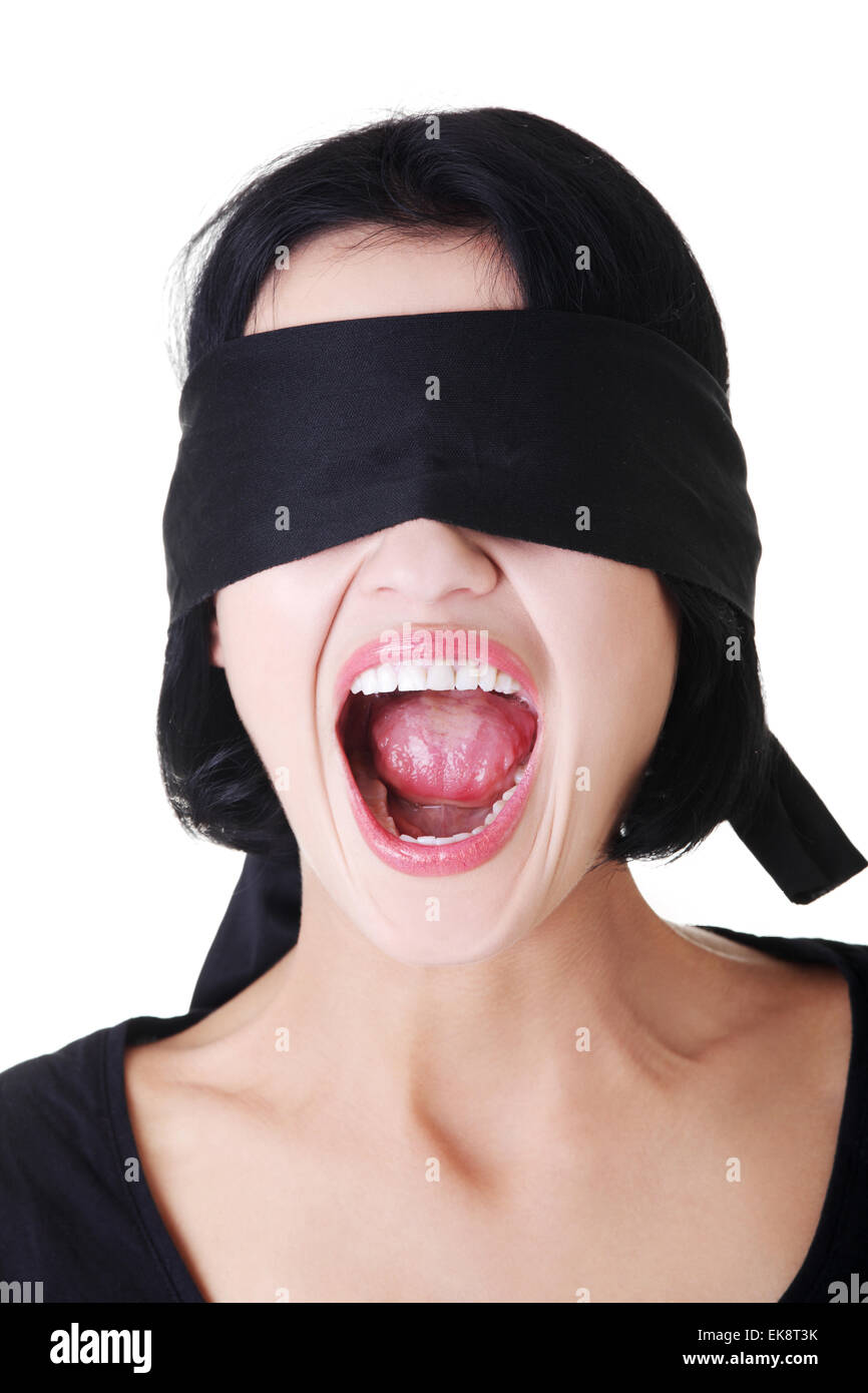 Portrait of young blindfold woman screaming Stock Photo