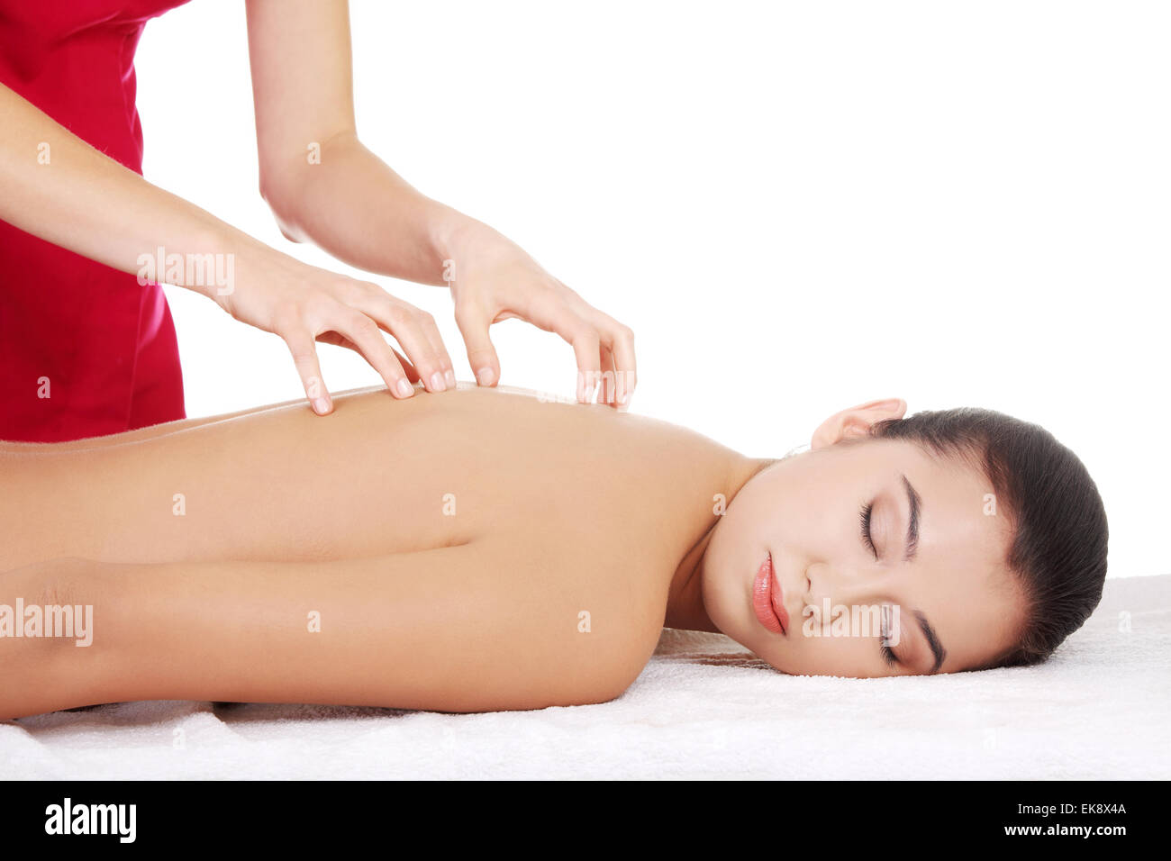 Young woman relaxing beeing massaged Stock Photo