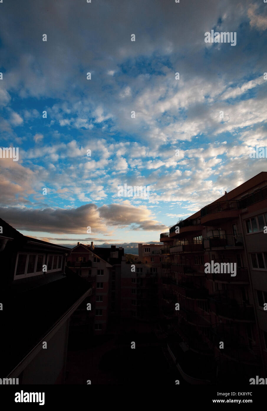 a house against the blue sky with the clouds Stock Photo - Alamy