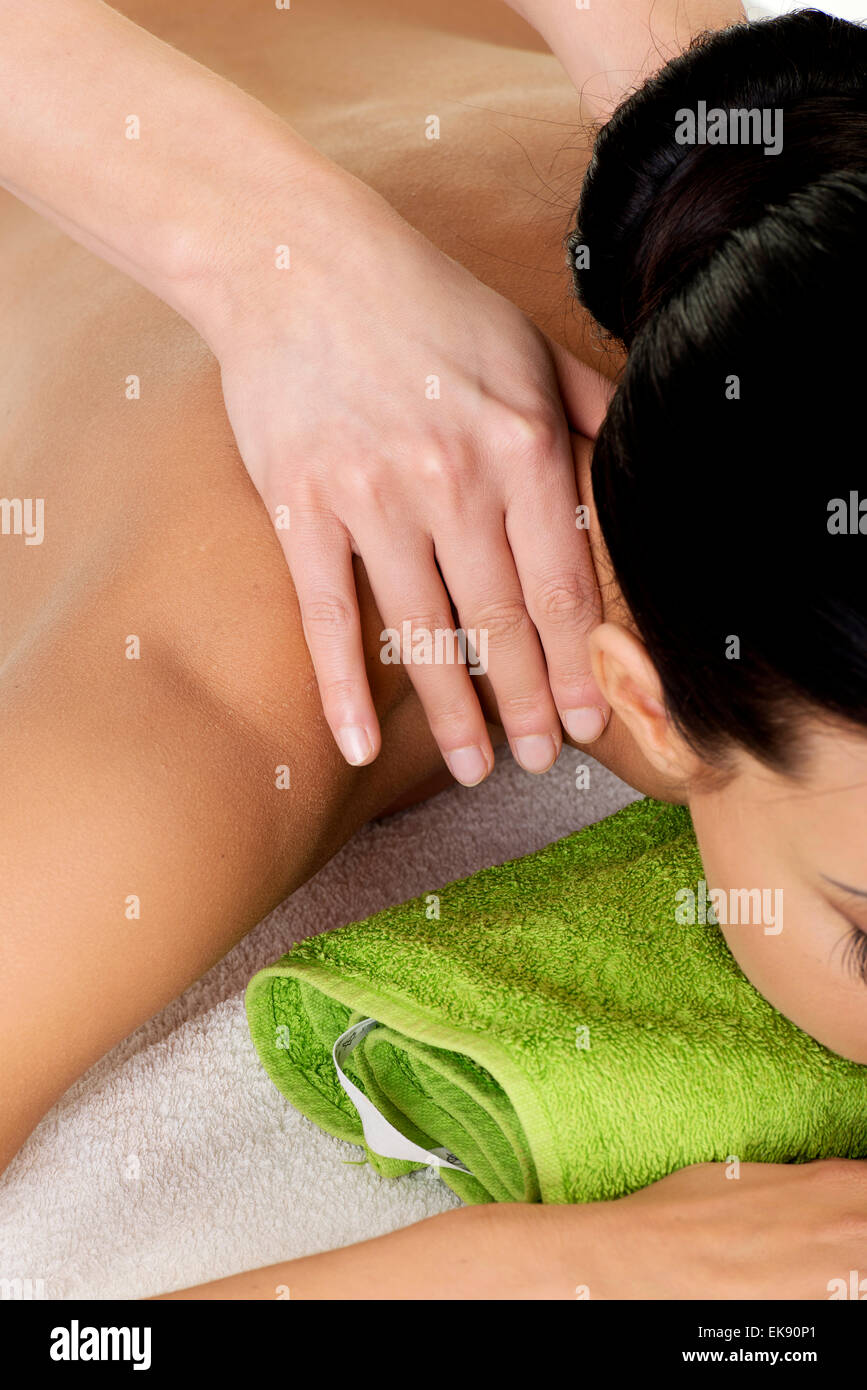 Preaty young woman relaxing beeing massaged Stock Photo