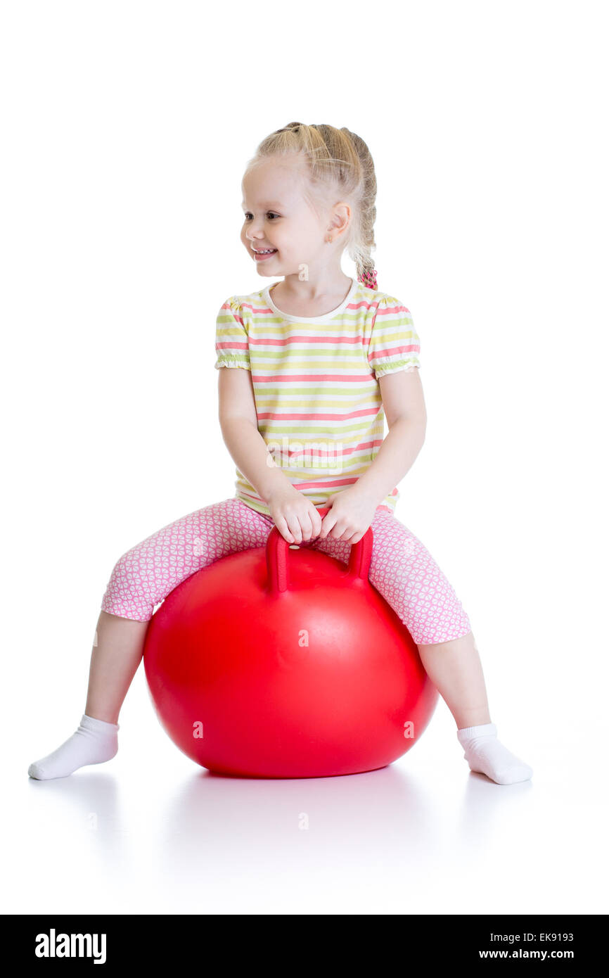 happy child jumping on bouncing ball Stock Photo