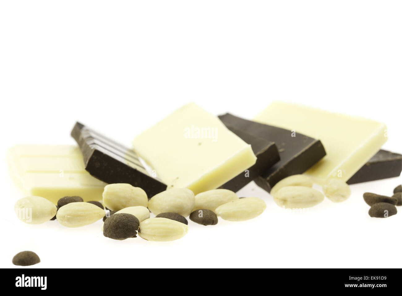 Tiles of dark and white chocolate isolated on white Stock Photo