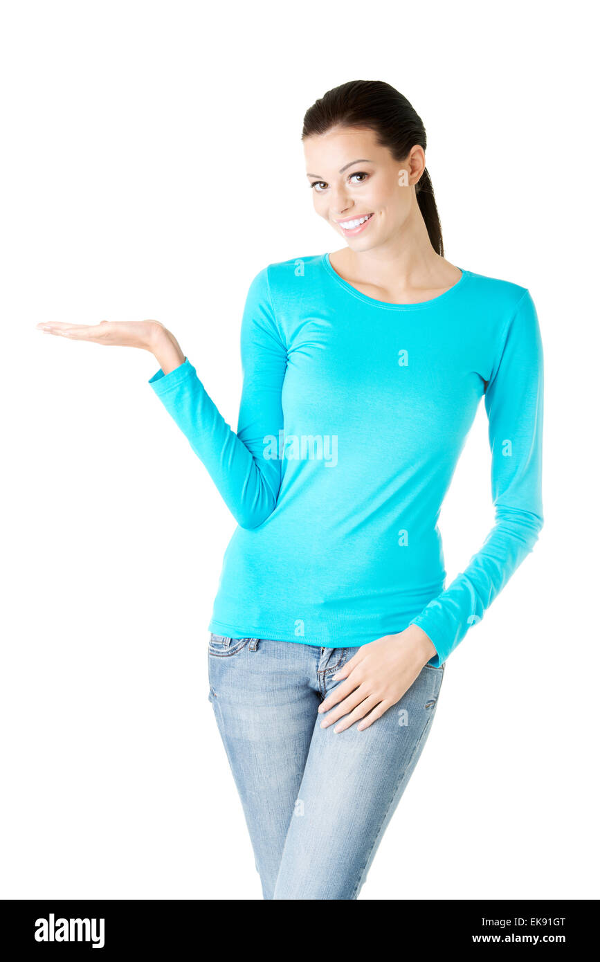 Young woman presenting copy space on her palm Stock Photo - Alamy
