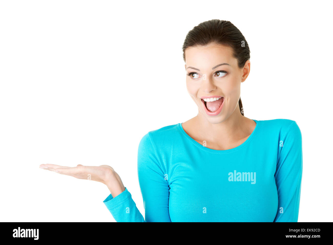 Young woman presenting copy space on her palm Stock Photo - Alamy