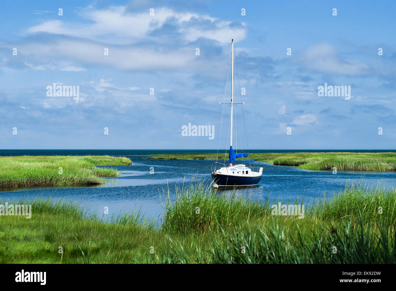 Sailboat docked in salt marsh, Yarmouth, Cape Cod, Massachusetts, USA Stock Photo