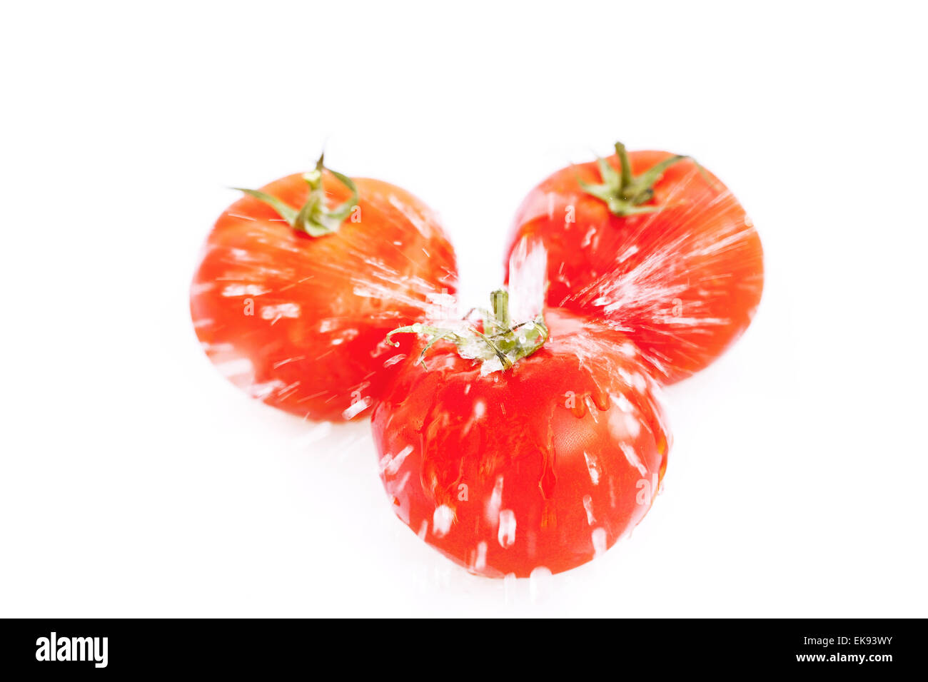 tomatoes with drops of water isolated on white Stock Photo - Alamy