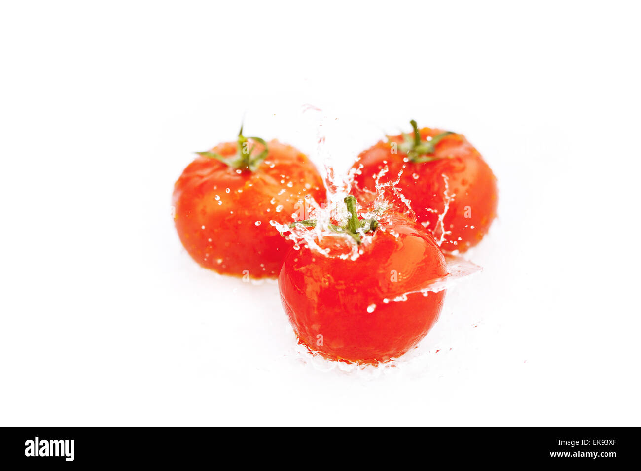 tomatoes with drops of water isolated on white Stock Photo - Alamy