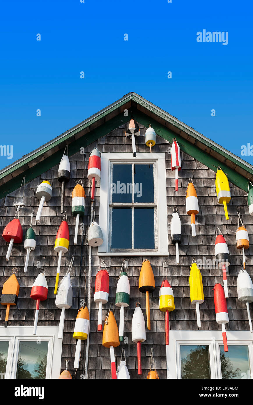 Buoys hung on the facade of a rustic coastal shack, Maine, USA Stock Photo
