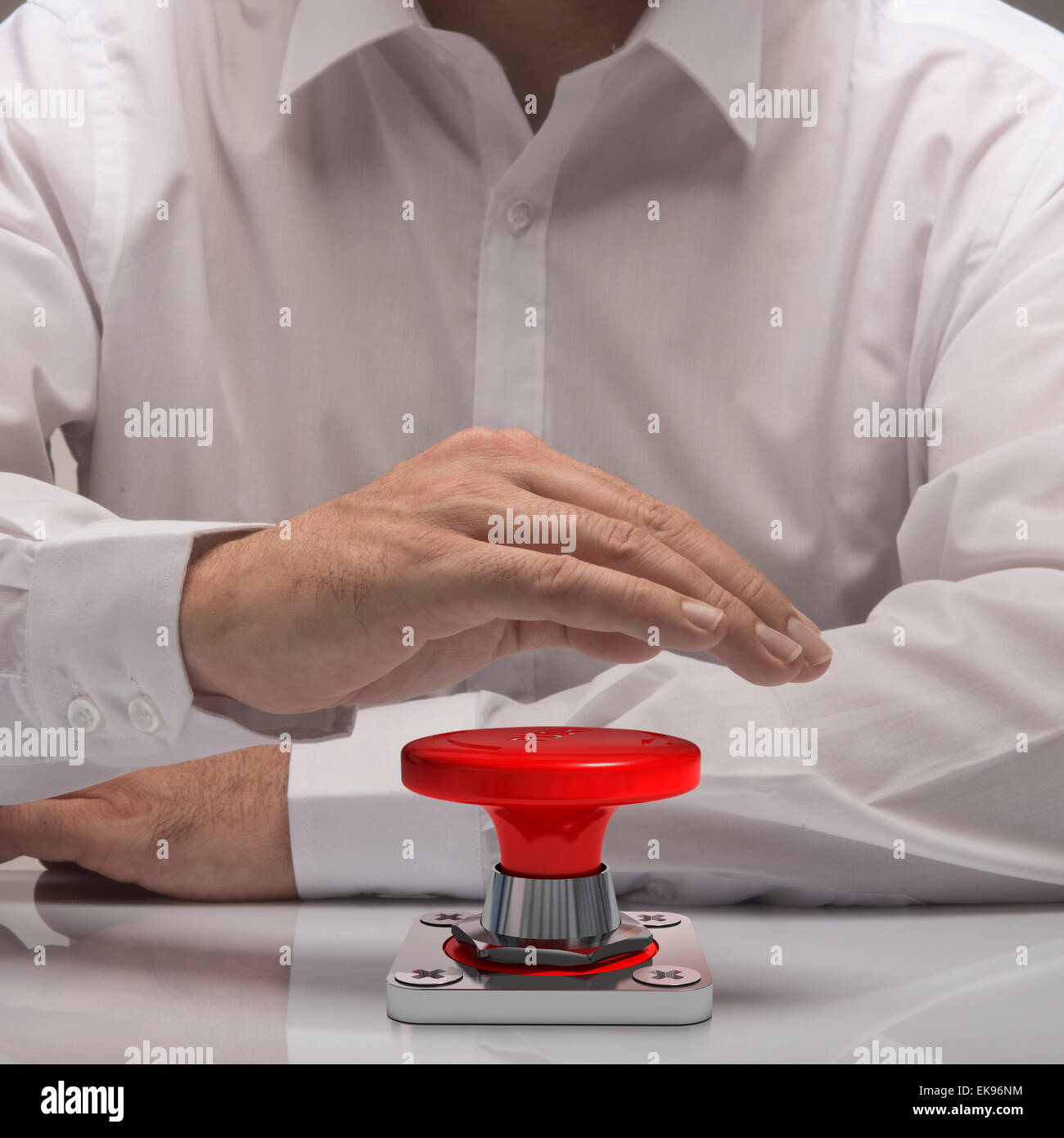 hand pushing emergency button, white shirt and reflexion. symbol of urgency and problem solving Stock Photo