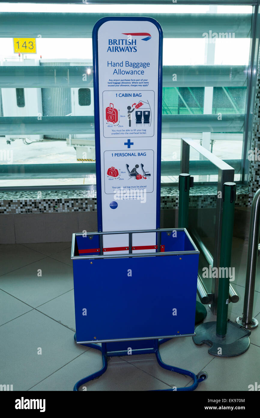 BA bag size frame cage tester to measure dimensions of passenger hand held carry on flight hand luggage. Lisbon Portela Airport. Stock Photo