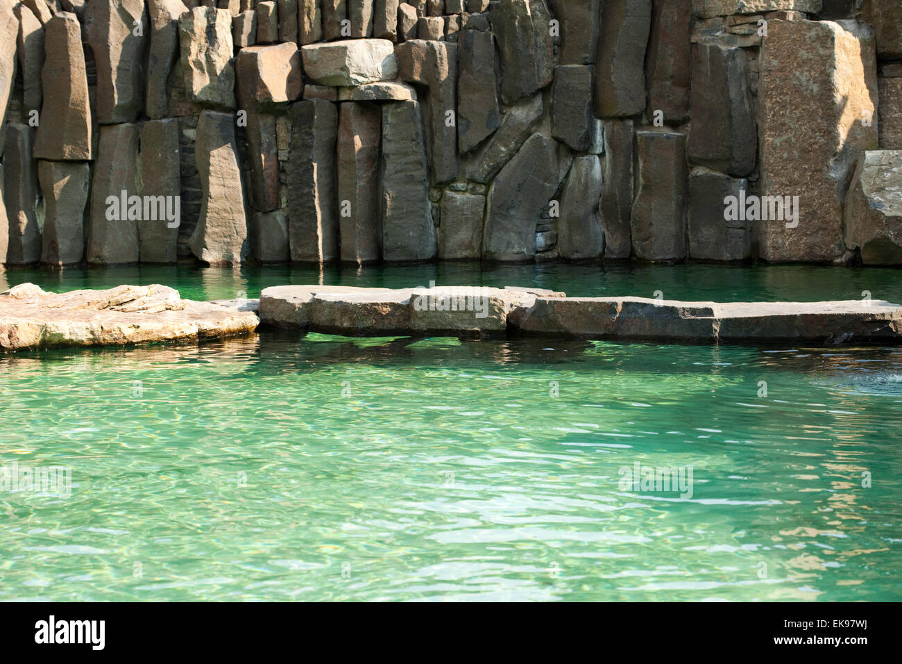 pool with blue water and rocks Stock Photo - Alamy