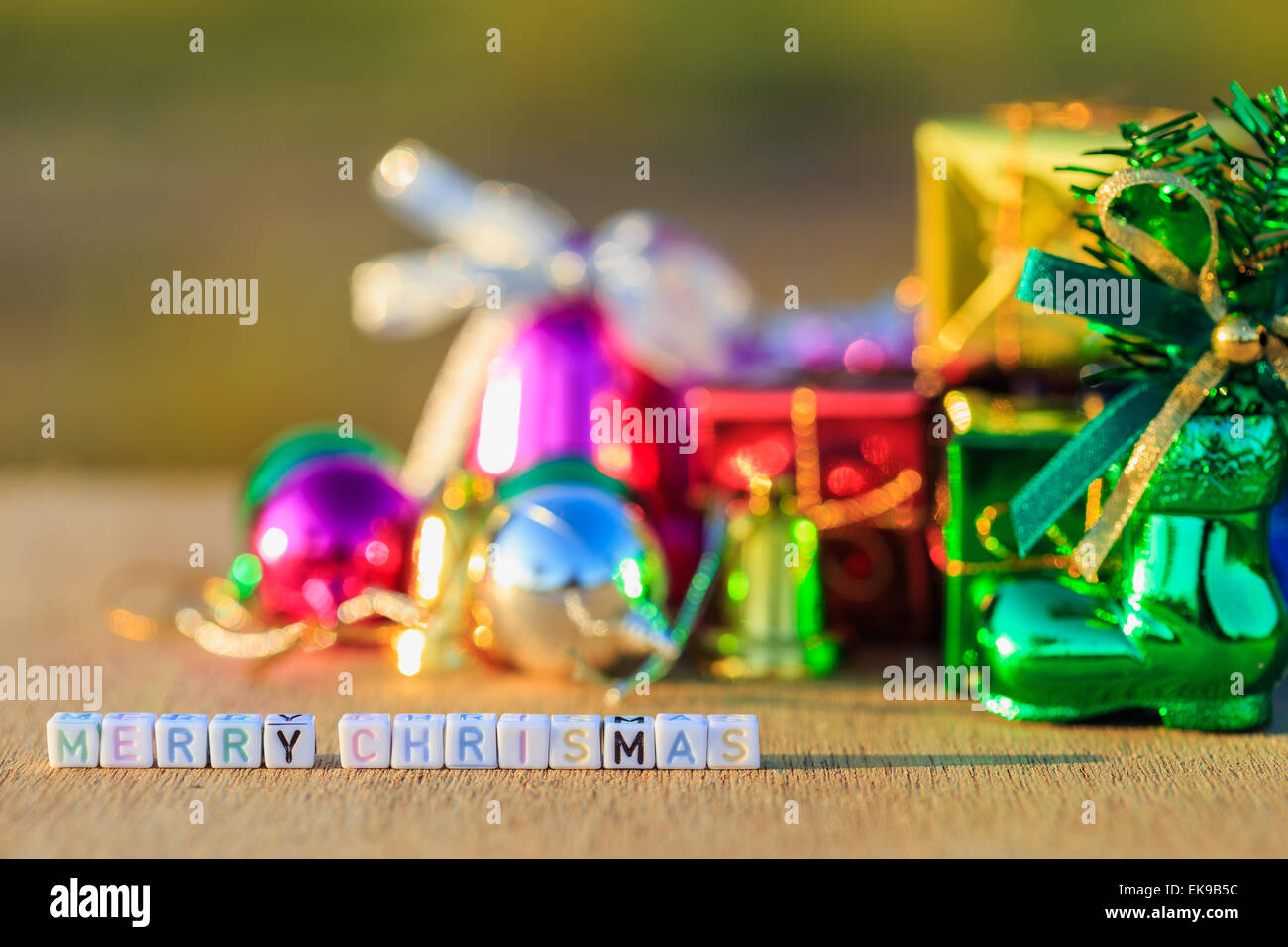Merry Chrismas written in letter beads and Christmas decorations Stock Photo