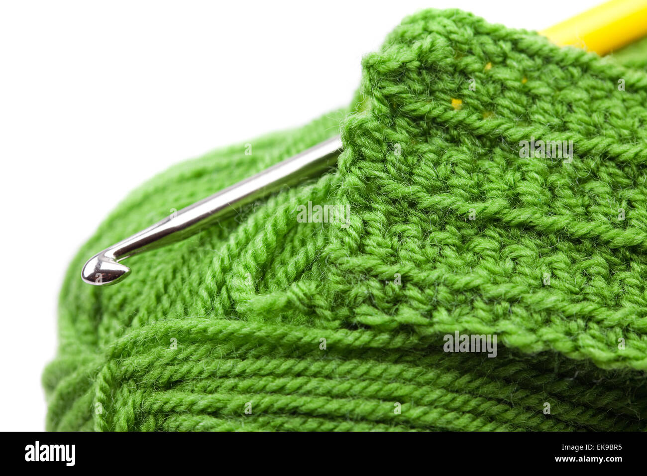 Skein of wool, crochet hook and knitted piece isolated on white Stock ...