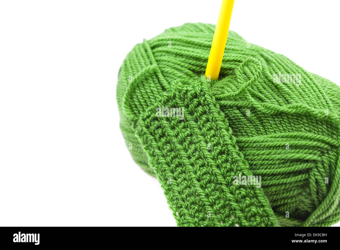 Skein of wool, crochet hook and knitted piece isolated on white Stock ...