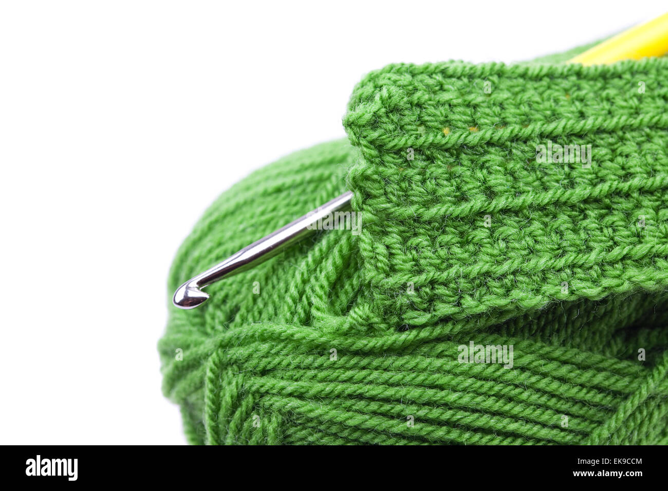 Skein of wool, crochet hook and knitted piece isolated on white Stock ...