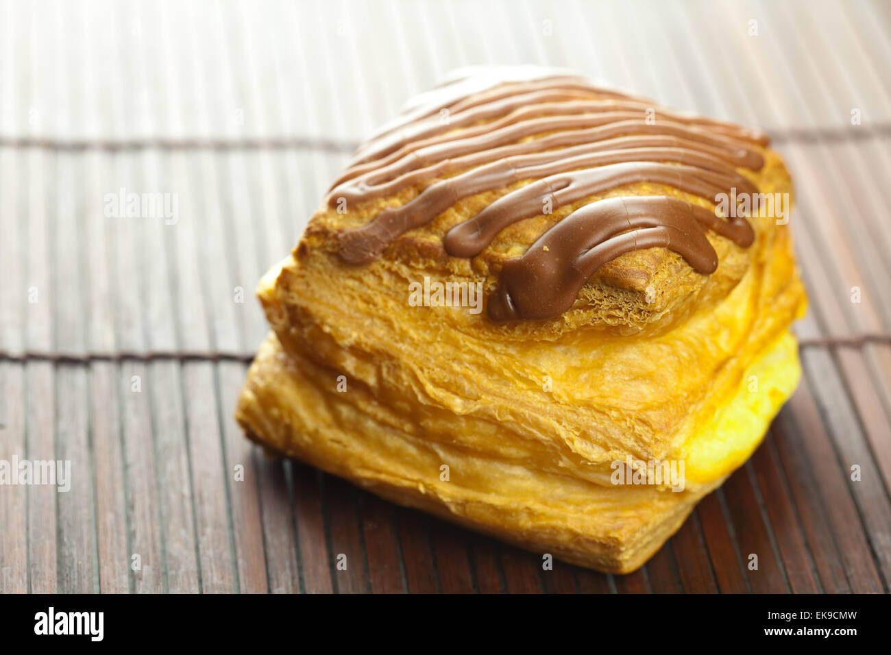 cake with chocolate lying on a bamboo mat Stock Photo