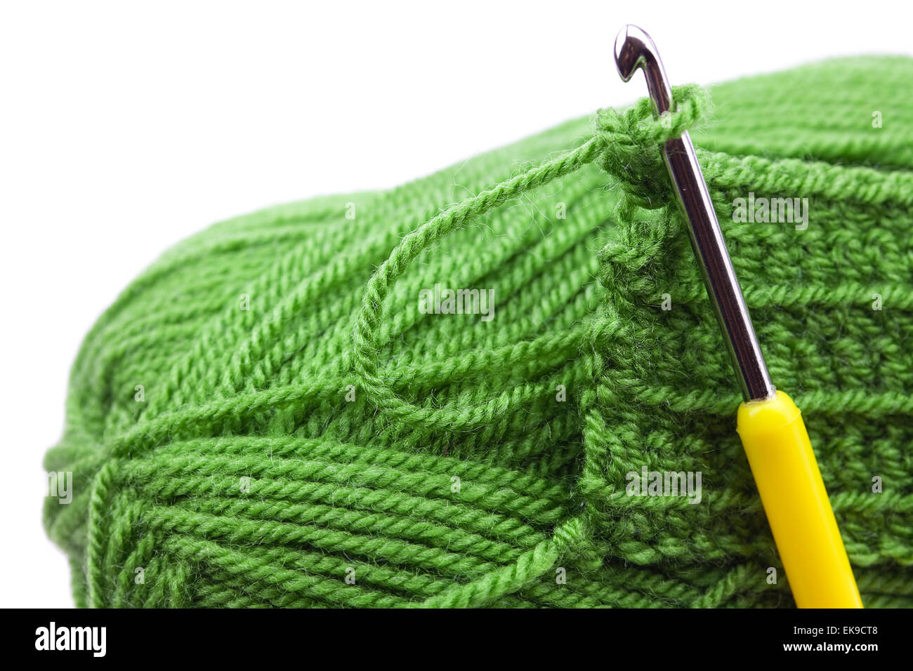 Skein of wool, crochet hook and knitted piece isolated on white Stock ...