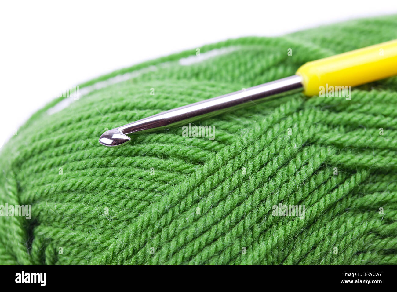 Skein of wool, crochet hook and knitted piece isolated on white Stock ...