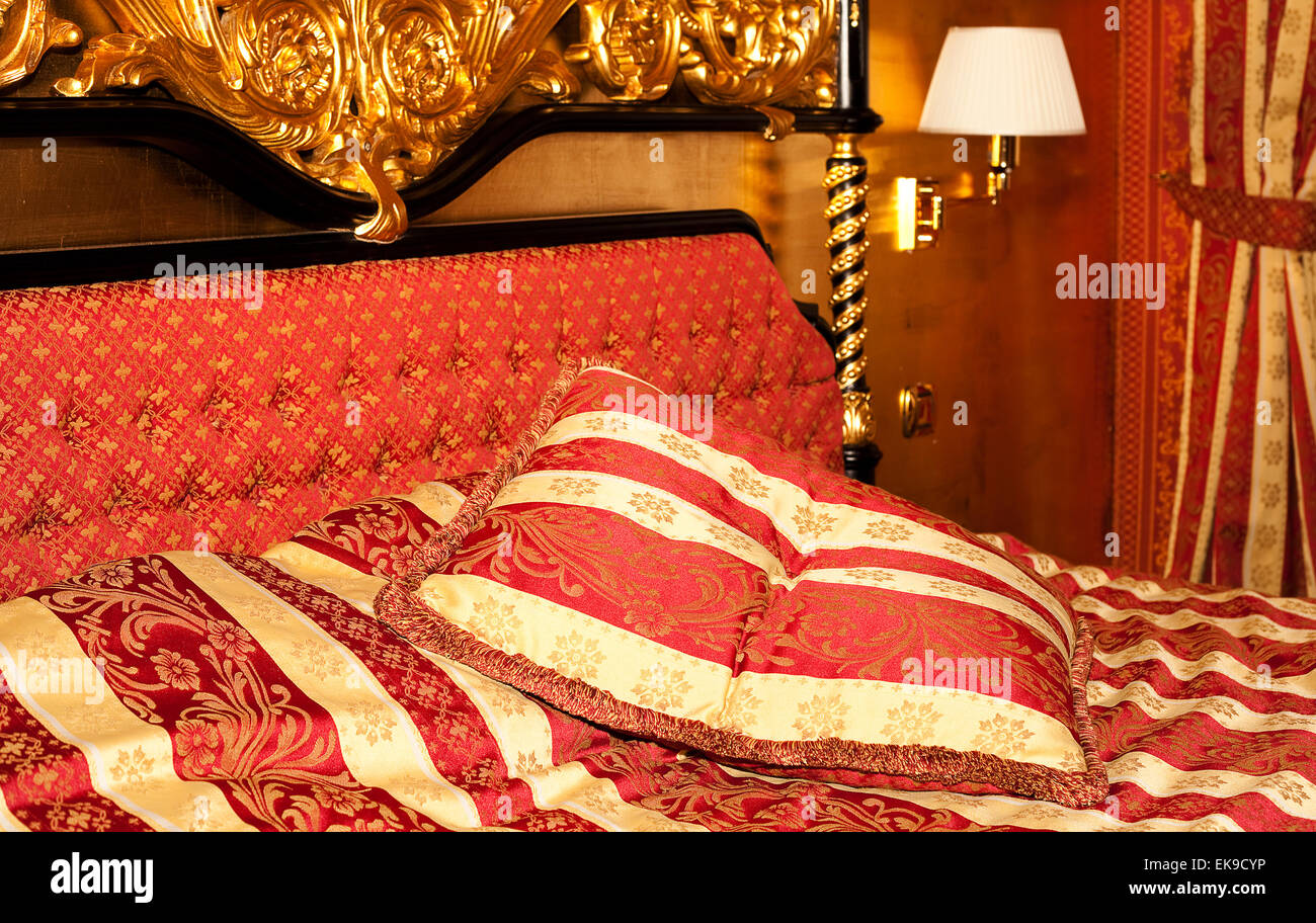 bed  in the gold room of the hotel Stock Photo