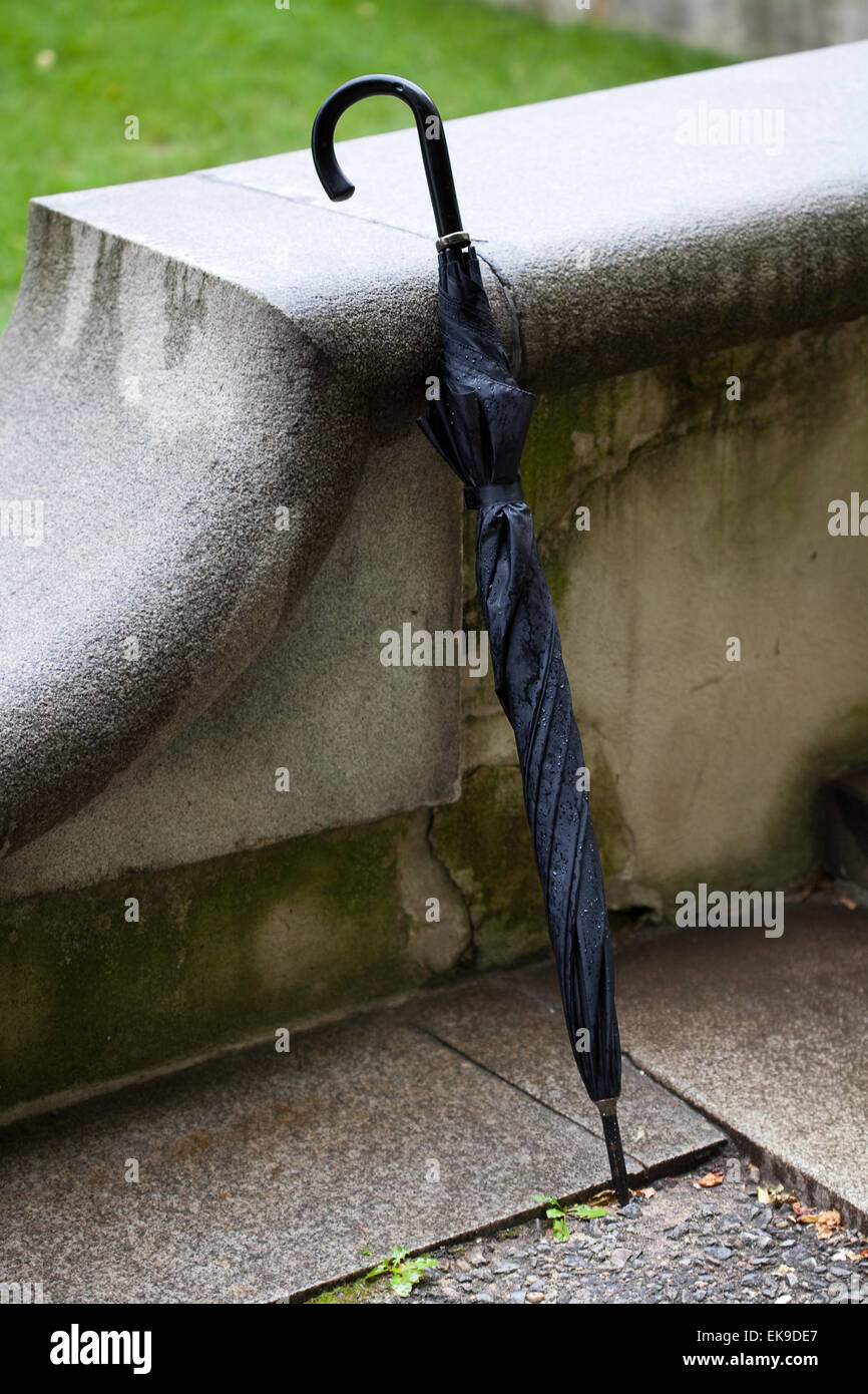 umbrella standing by the concrete parapet Stock Photo Alamy