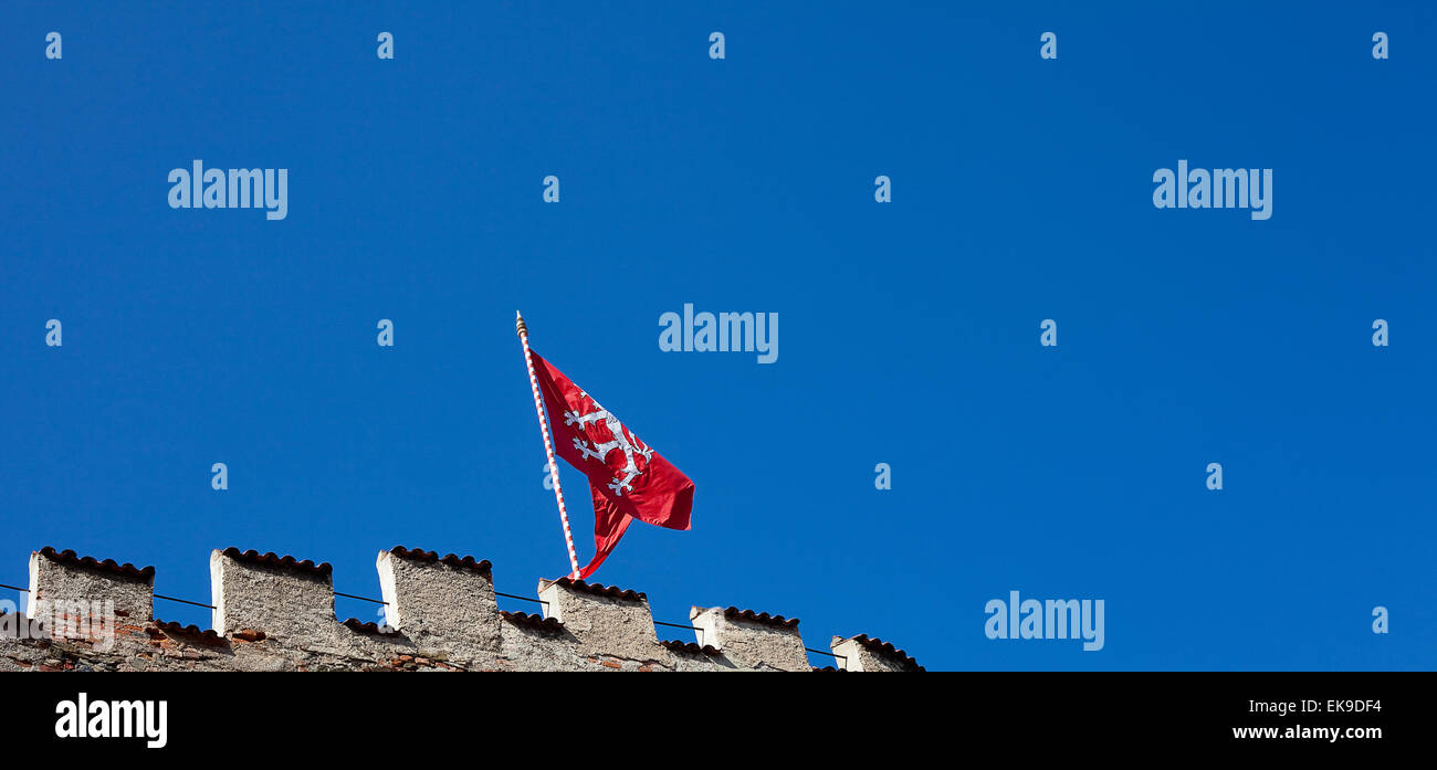 red flag of the fortress against the blue sky Stock Photo
