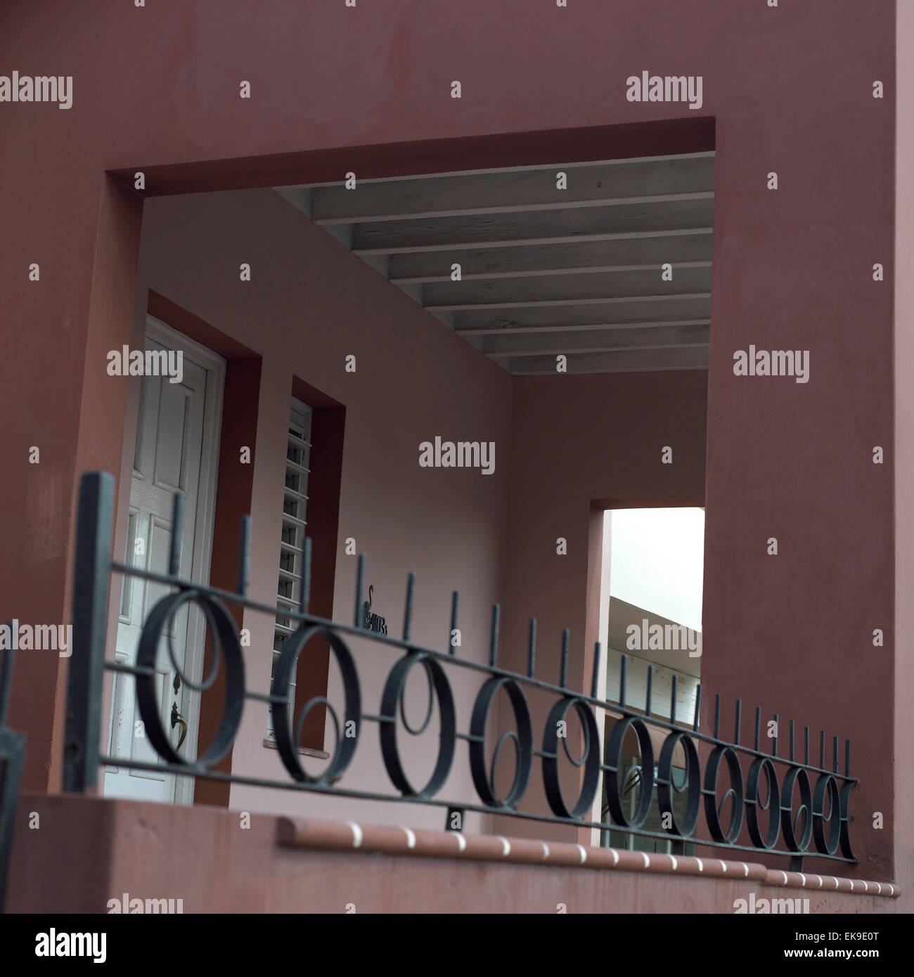Iron railing and walkway to entrance of a home Stock Photo - Alamy