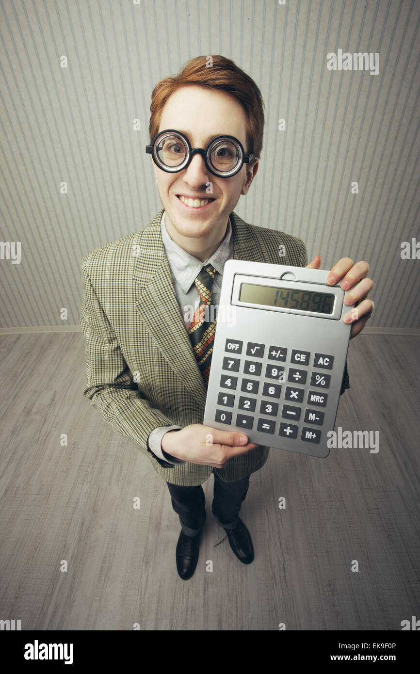 Integer Guy A nerdy guy with a giant-sized calculator Stock Photo - Alamy