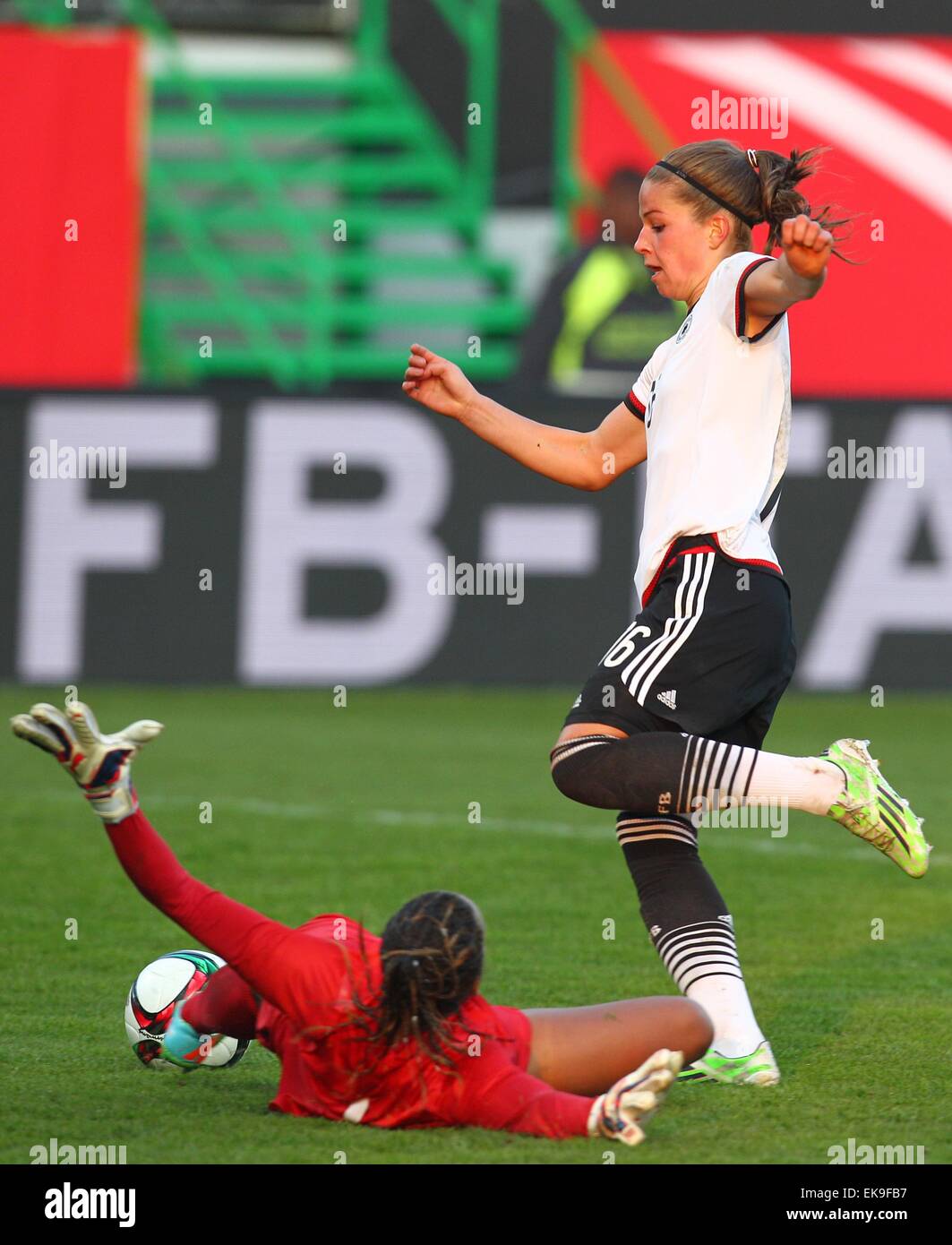 Fuerth, Germany. 08th Apr, 2015. Germany's Melanie Leupolz in action against Brazil's goalkeeper Barbara shortly before scoring the 3-0 during the women's international friendly soccer match between Germany and Brazil in Fuerth, Germany, 08 April 2015. Photo: KARL-JOSEF HILDENBRAND/dpa/Alamy Live News Stock Photo