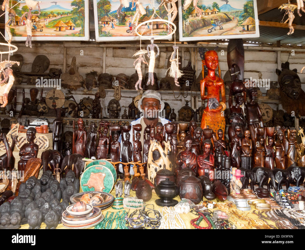 Congolese craft shop stall and stallholder or shopkeeper, Goma market, Democratic republic of Congo ( DRC ), Africa Stock Photo