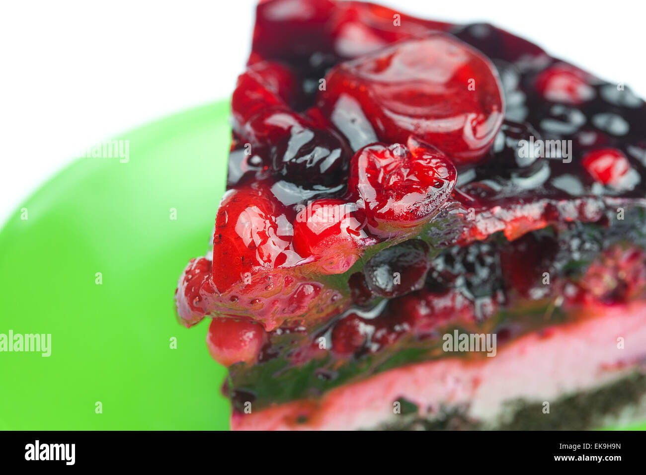 beautiful cake with berries on a plate isolated on white Stock Photo ...