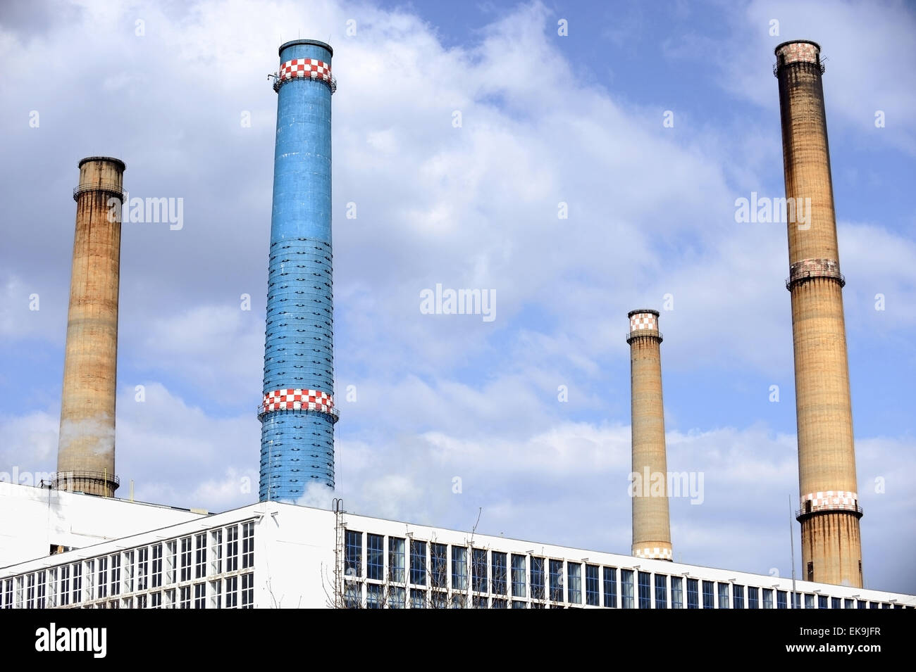 Industrial shot with four smoke towers of a thermal power plant Stock Photo