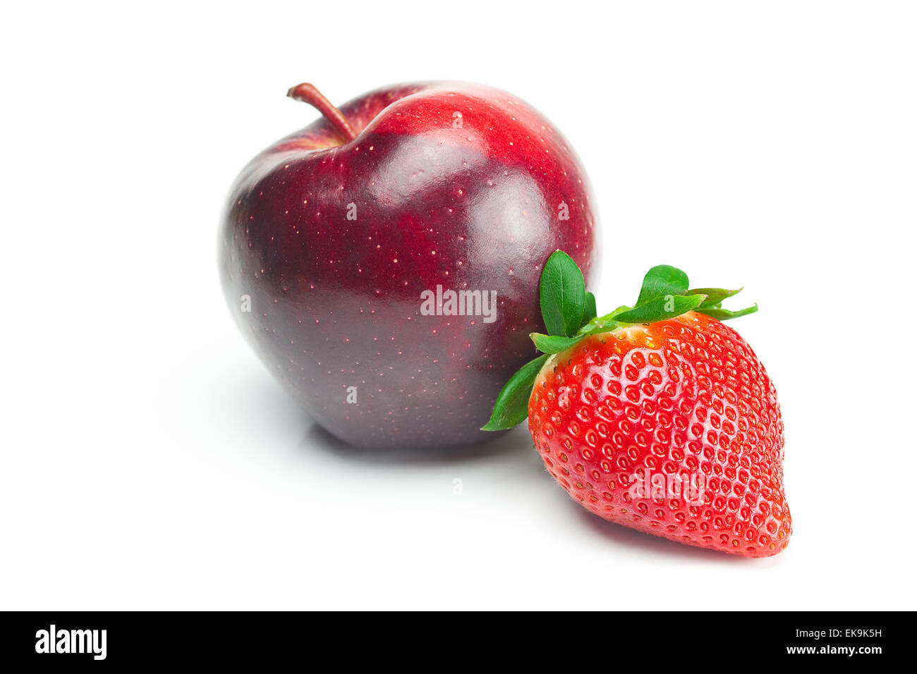 big juicy red ripe strawberries and apple isolated on white Stock Photo ...