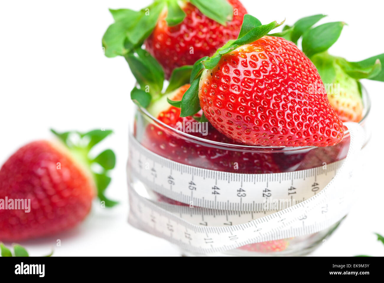 big juicy red ripe strawberries in a glass bowl isolated on whit Stock ...