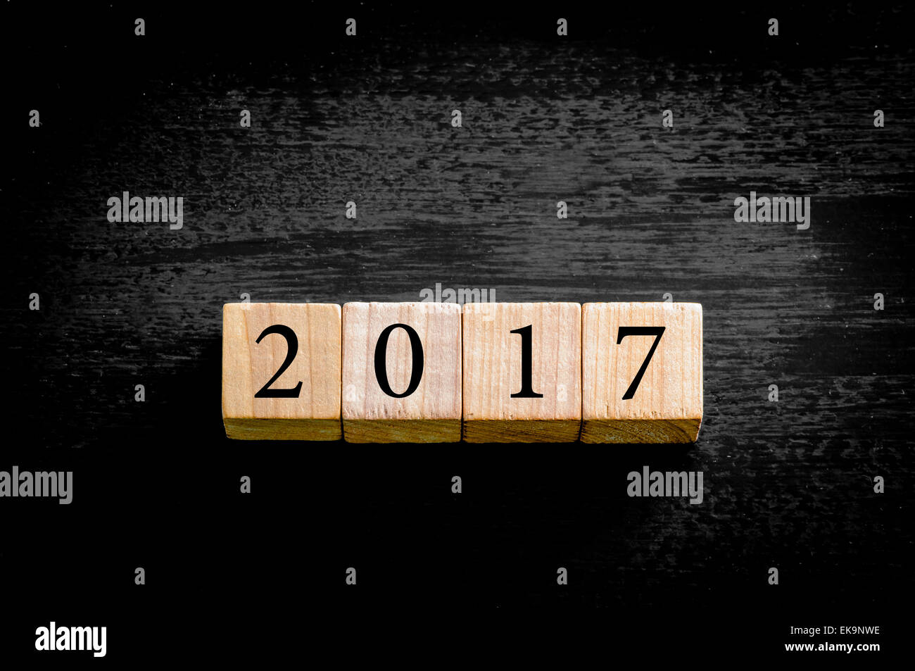 Year 2017. Wooden small cubes with numbers isolated on black background with copy space available. New Year Concept image. Stock Photo