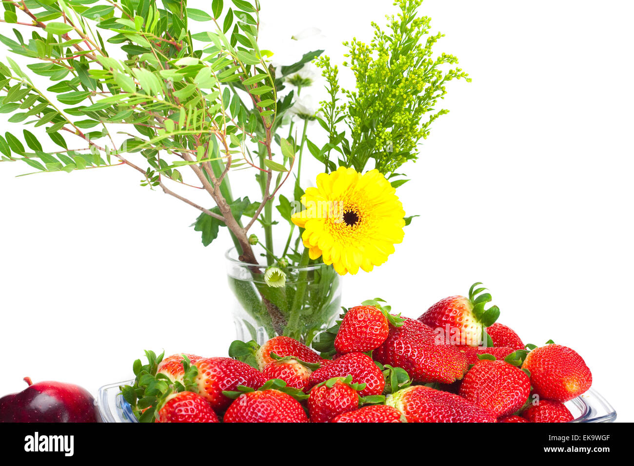 big juicy red ripe strawberries in a glass bowl and flower isola Stock ...